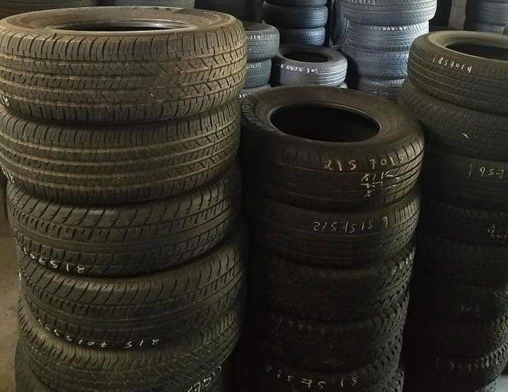 A bunch of tires are stacked on top of each other