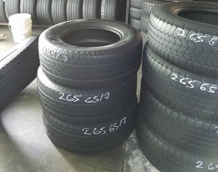 A stack of tires with the numbers 265 on them