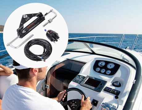 Man piloting a boat; steering wheel visible. Boat steering system components on the left. Blue water background.