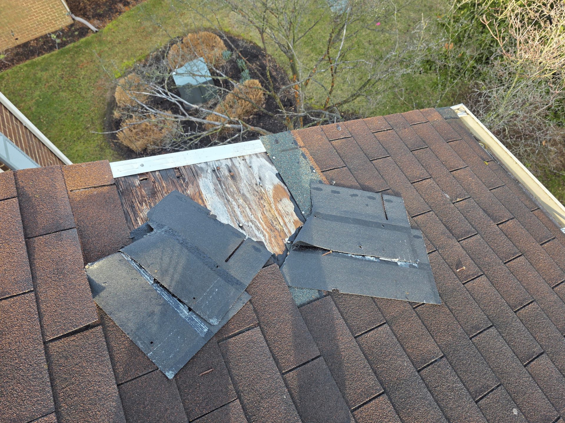 Wind Damaged Shingles on Maryland Roof during Roof Inspection by American Remodeling Corp.