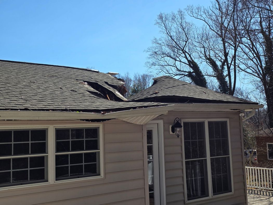 Severly Damaged Shingle Roof Storm damage in Central Maryland