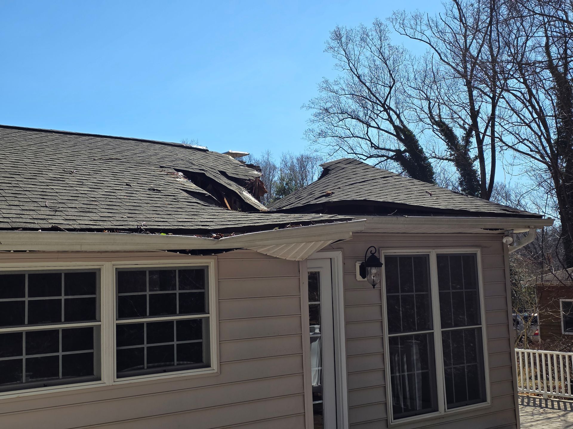 Severly Damaged Shingle Roof Storm damage in Central Maryland