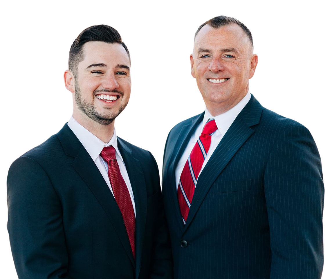 Two men in suits smiling, red ties, against a white background.