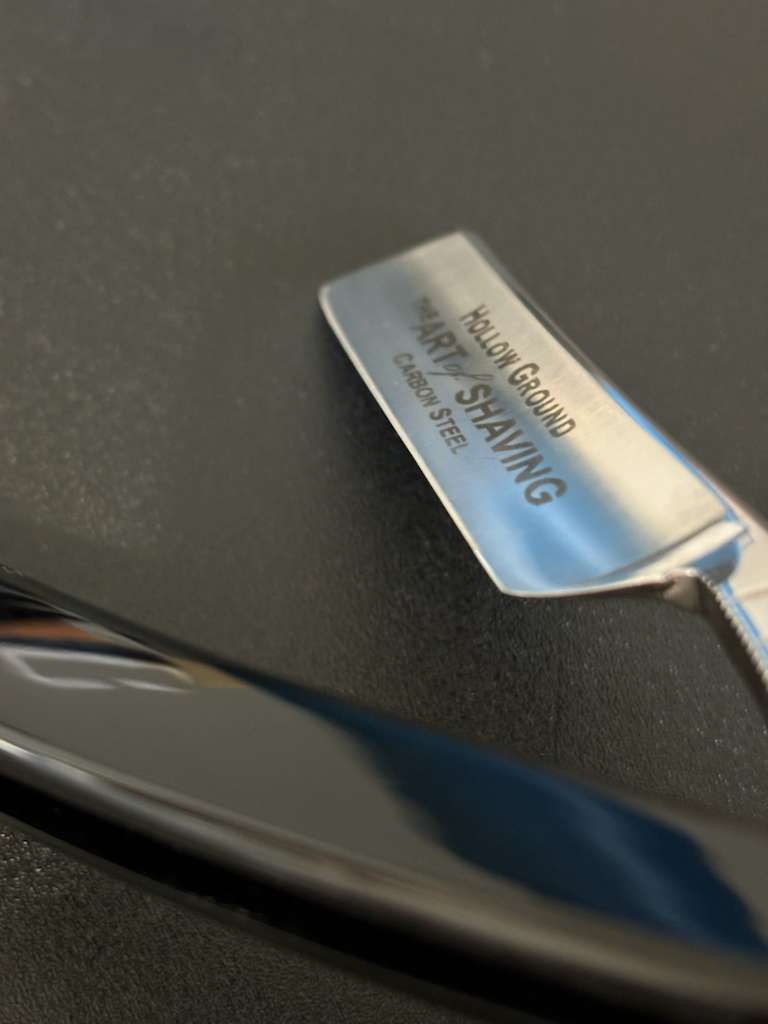 Close-up of a straight razor with 