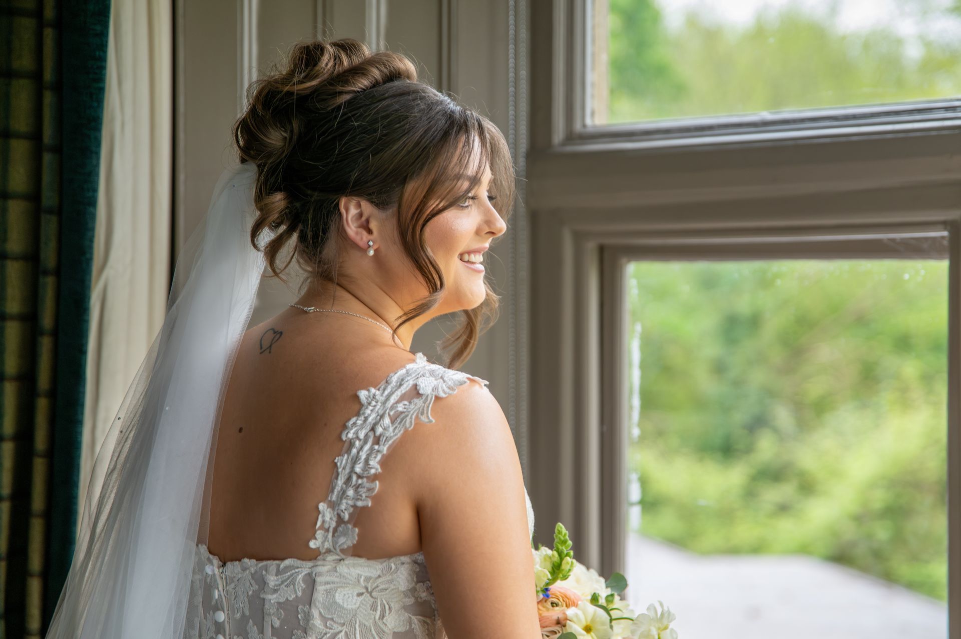 Your trusted wedding photographer - LS Photography - bride at window