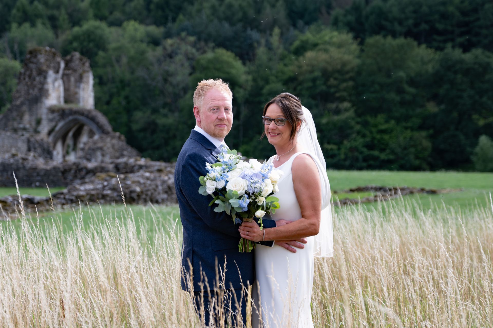 LS Photography - Trusted wedding photographer UK - couple in field