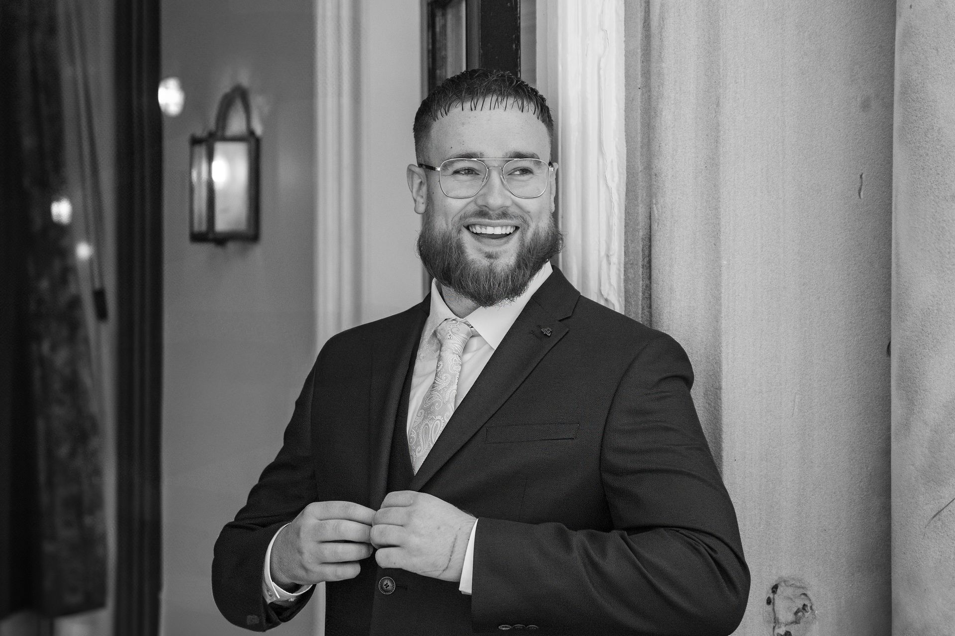 LS Photography - Trusted wedding photographer, groom black and white