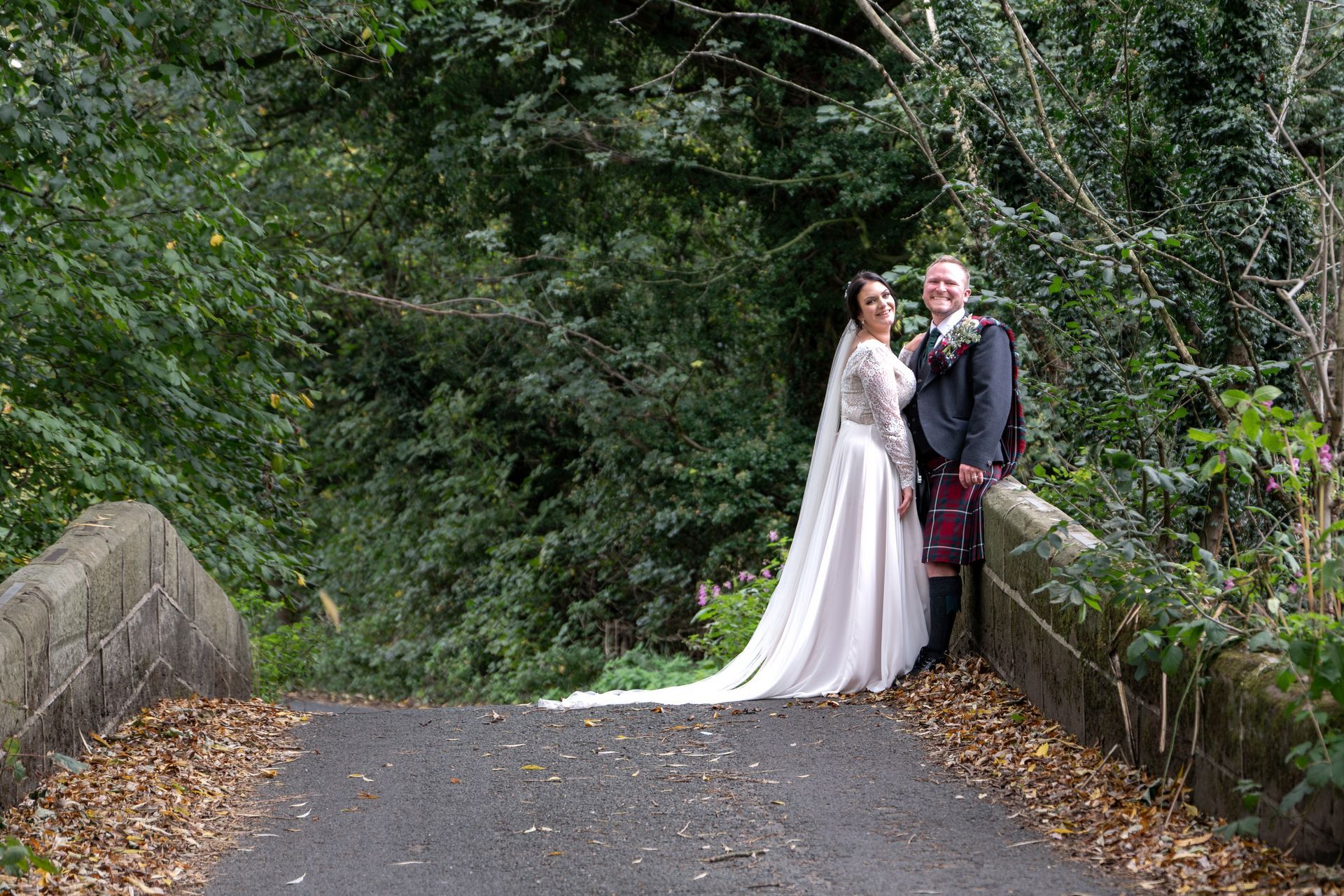 Your trusted wedding photographer - LS Photography - by a bridge