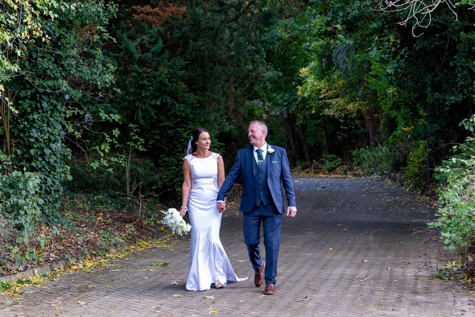 LS Photography - Trusted wedding photographer, couple walking