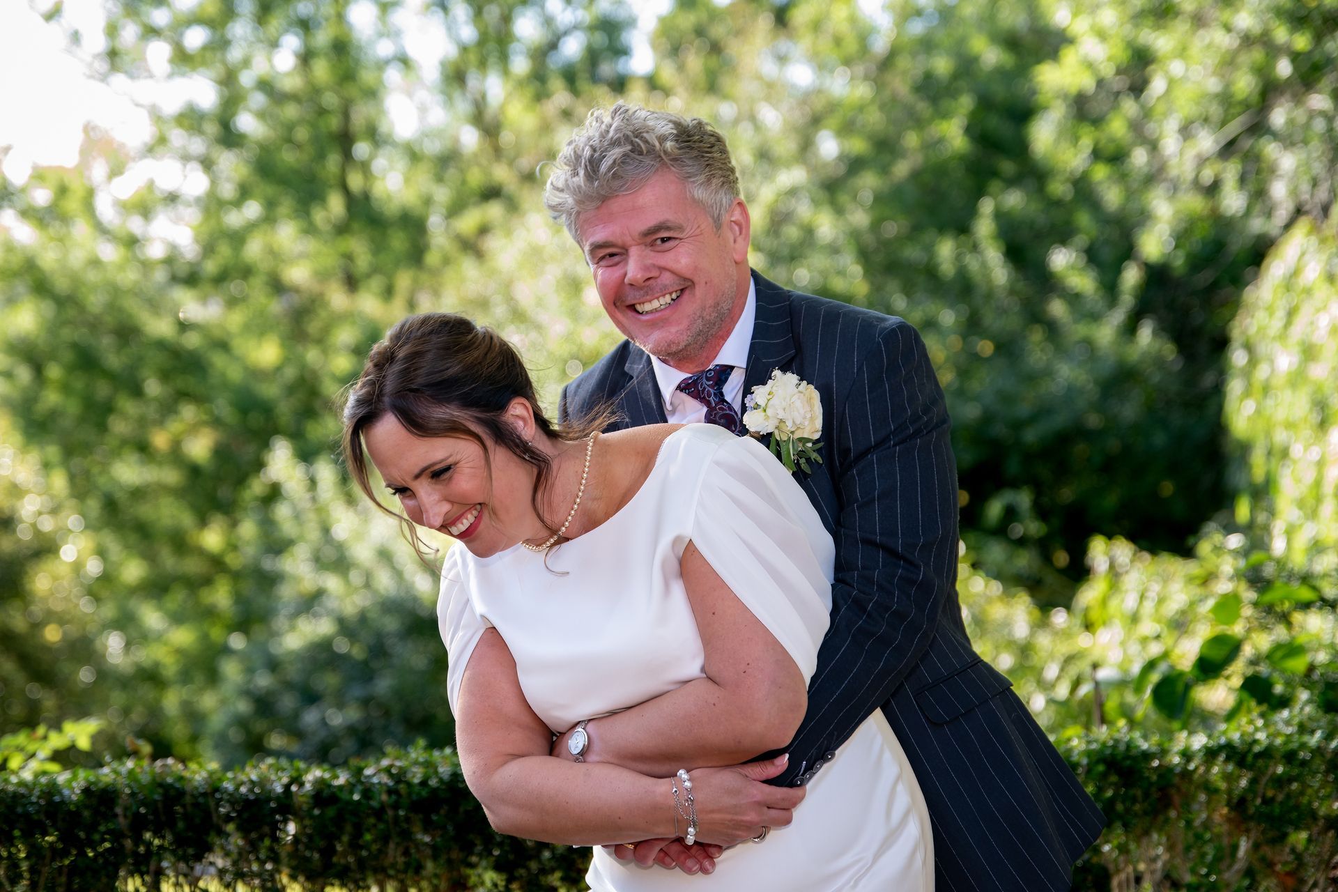 LS Photography - Trusted wedding photographer taking fun couple images