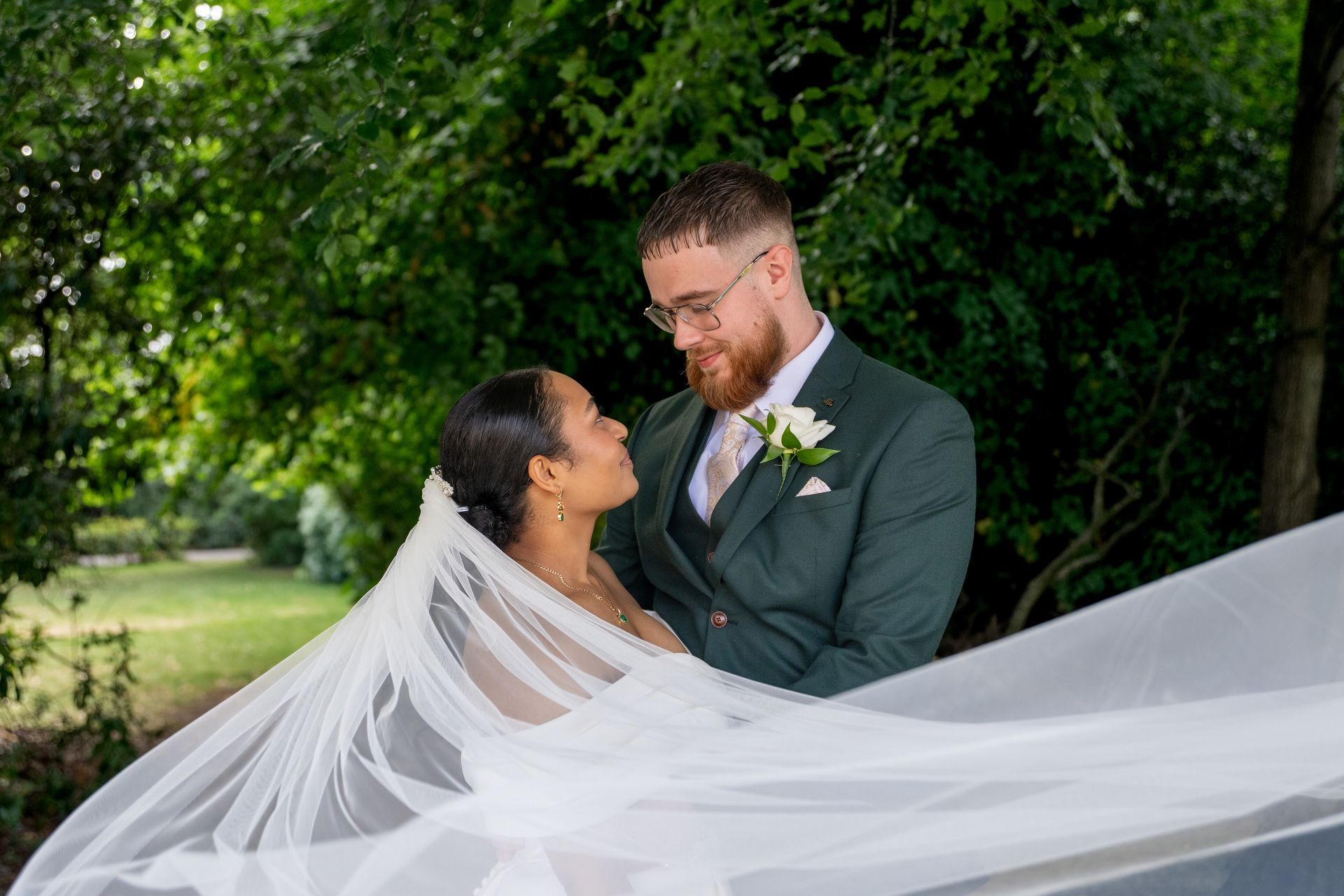 LS Photography - Trusted wedding photographer, couple, showing veil