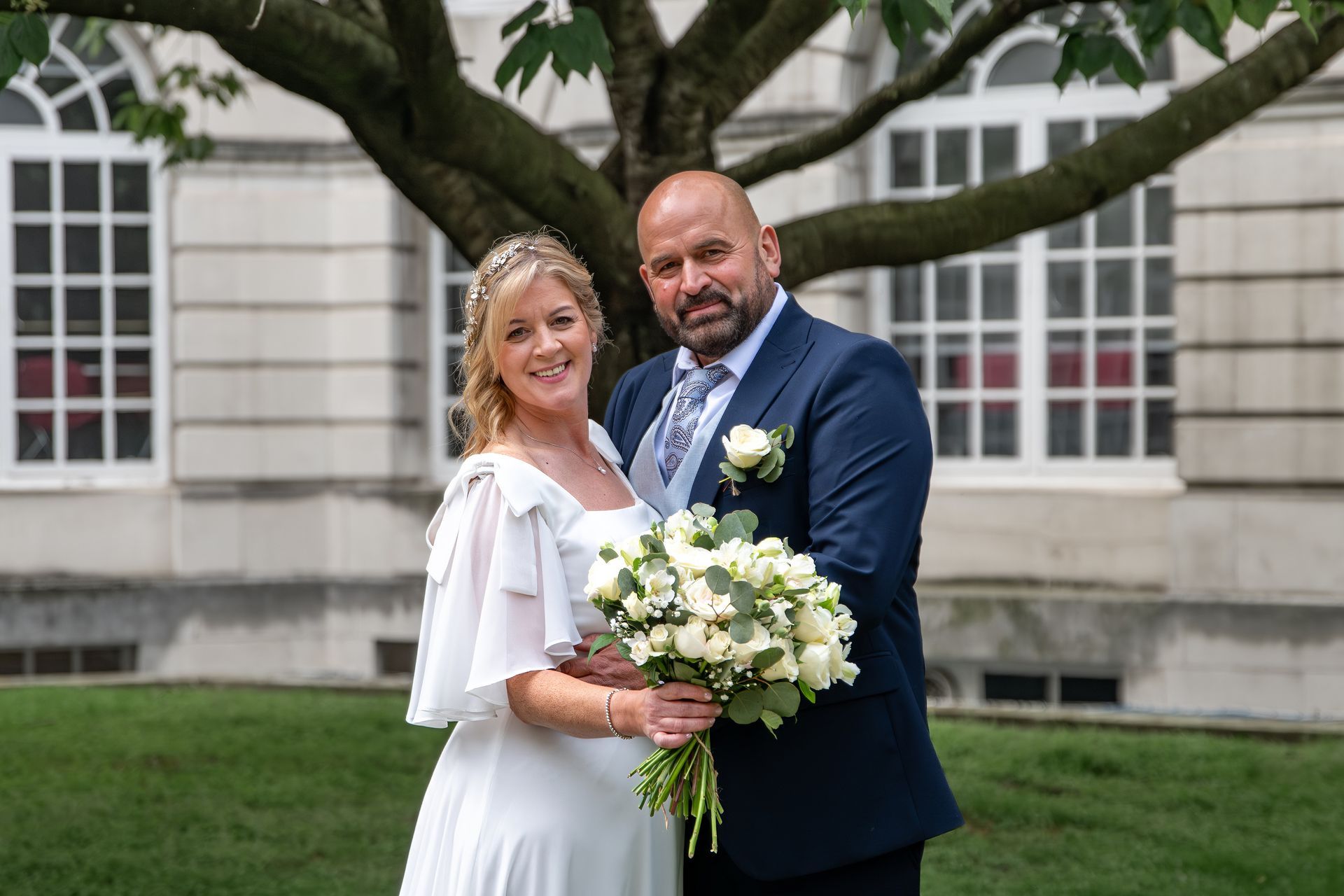 L.S. Photography - your local wedding photographer in front of tree