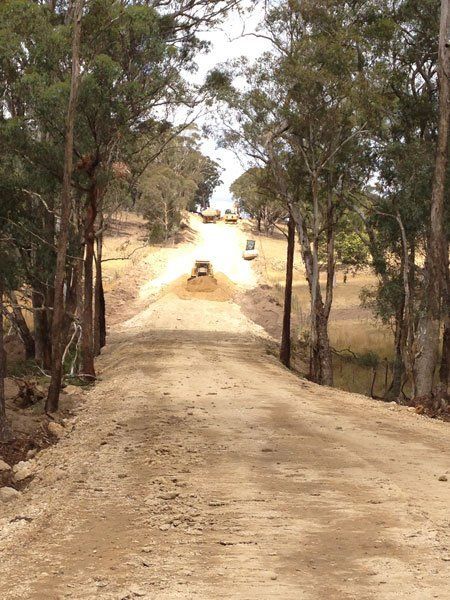 Heavy Equipment on the Road — Marulan, NSW — Coopers Earthmoving Pty Ltd