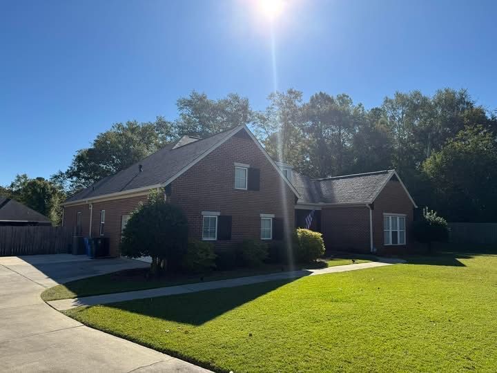 A gutter attached to the side of a building, efficiently directing rainwater away from the structure to prevent water damage.