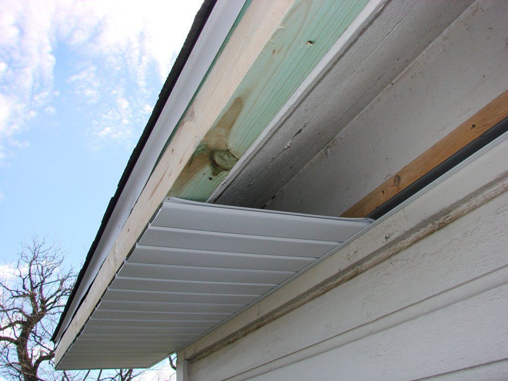 A gutter attached to the side of a building, efficiently directing rainwater away from the structure to prevent water damage.