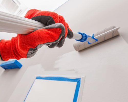 A gutter attached to the side of a building, efficiently directing rainwater away from the structure to prevent water damage.