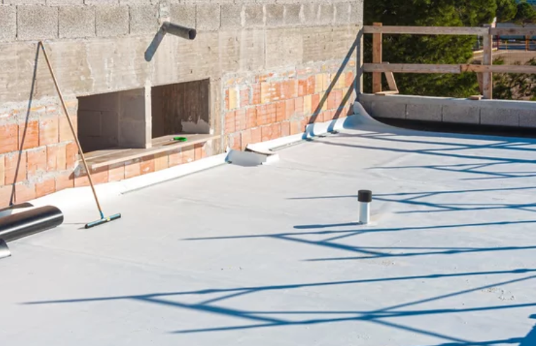 An image showing a seamless coating system being applied to a roof.