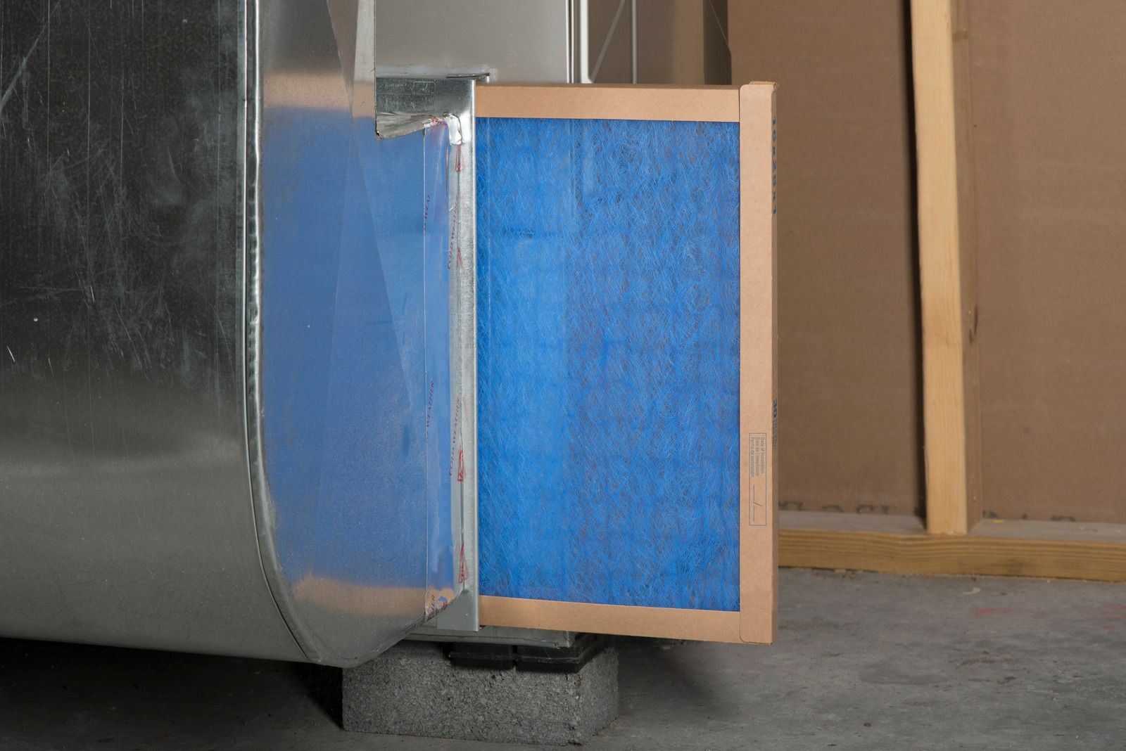 The inside of a moving truck filled with boxes and blankets.