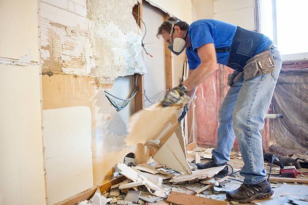 An image of a person Removing Drywall.