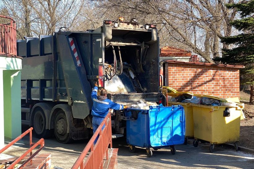 An image of bins of debris being picked up.
