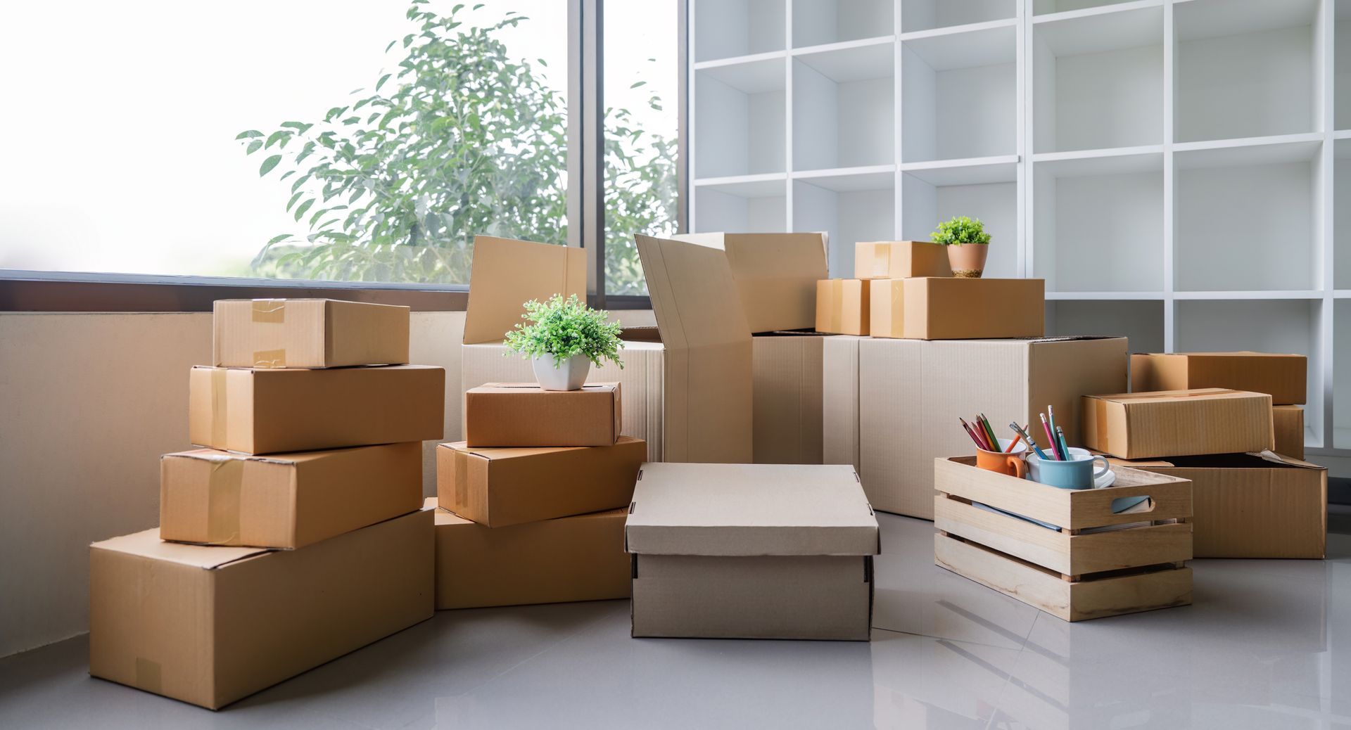 A room filled with lots of cardboard boxes and shelves.