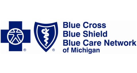 Blue Cross Blue Shield Blue Care Network of Michigan logo. Blue shield with caduceus, blue cross symbol.