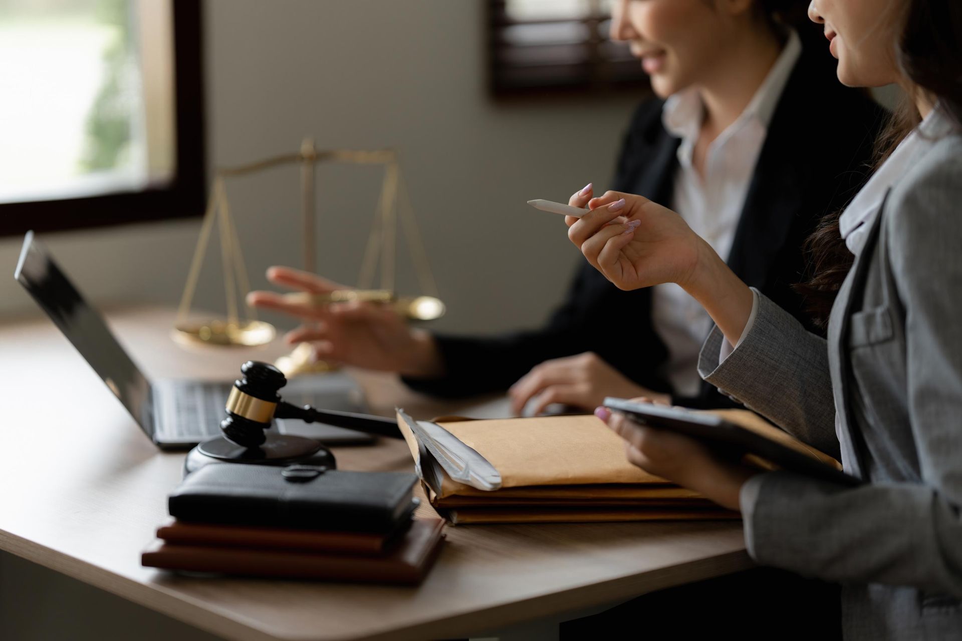 A living room with two couches, a fireplace, and a ceiling fan.