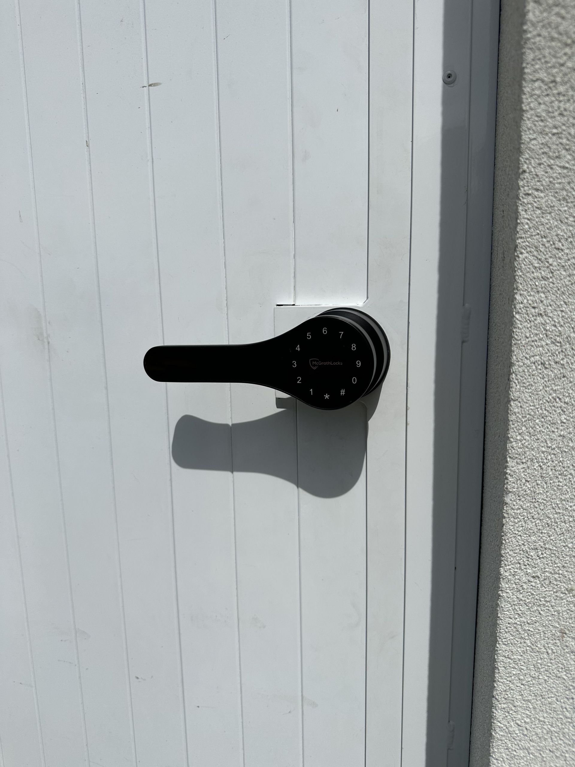 A bunch of keys are laying on a blue carpet.