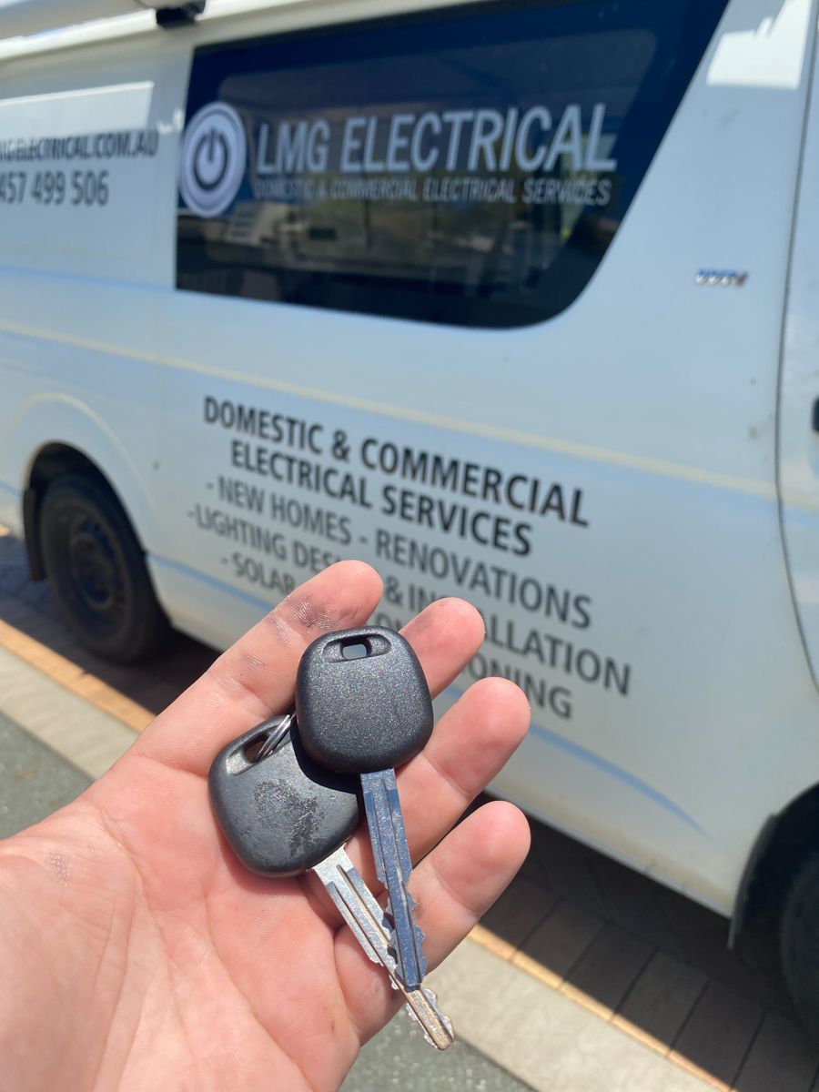 A person is installing a door knob on a wooden door.