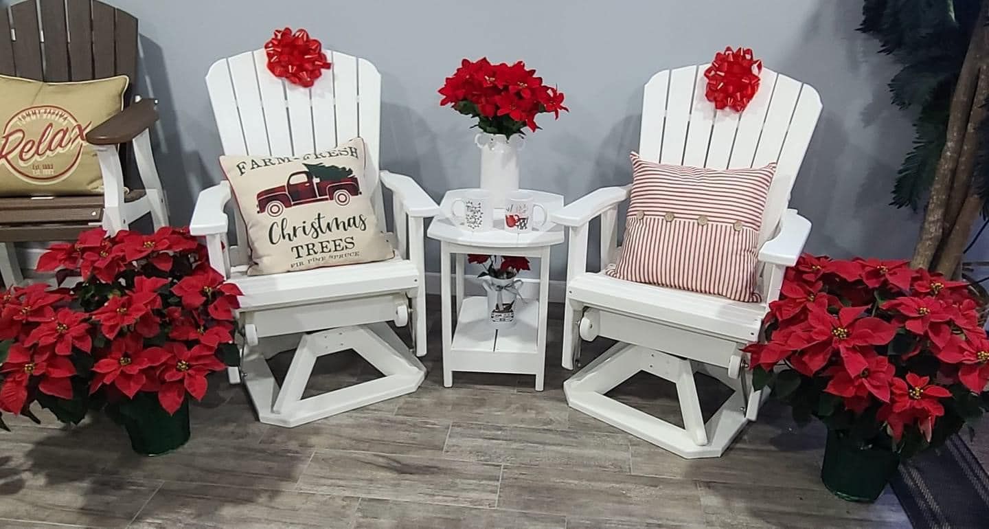 A couple of rocking chairs sitting next to each other on a wooden floor.