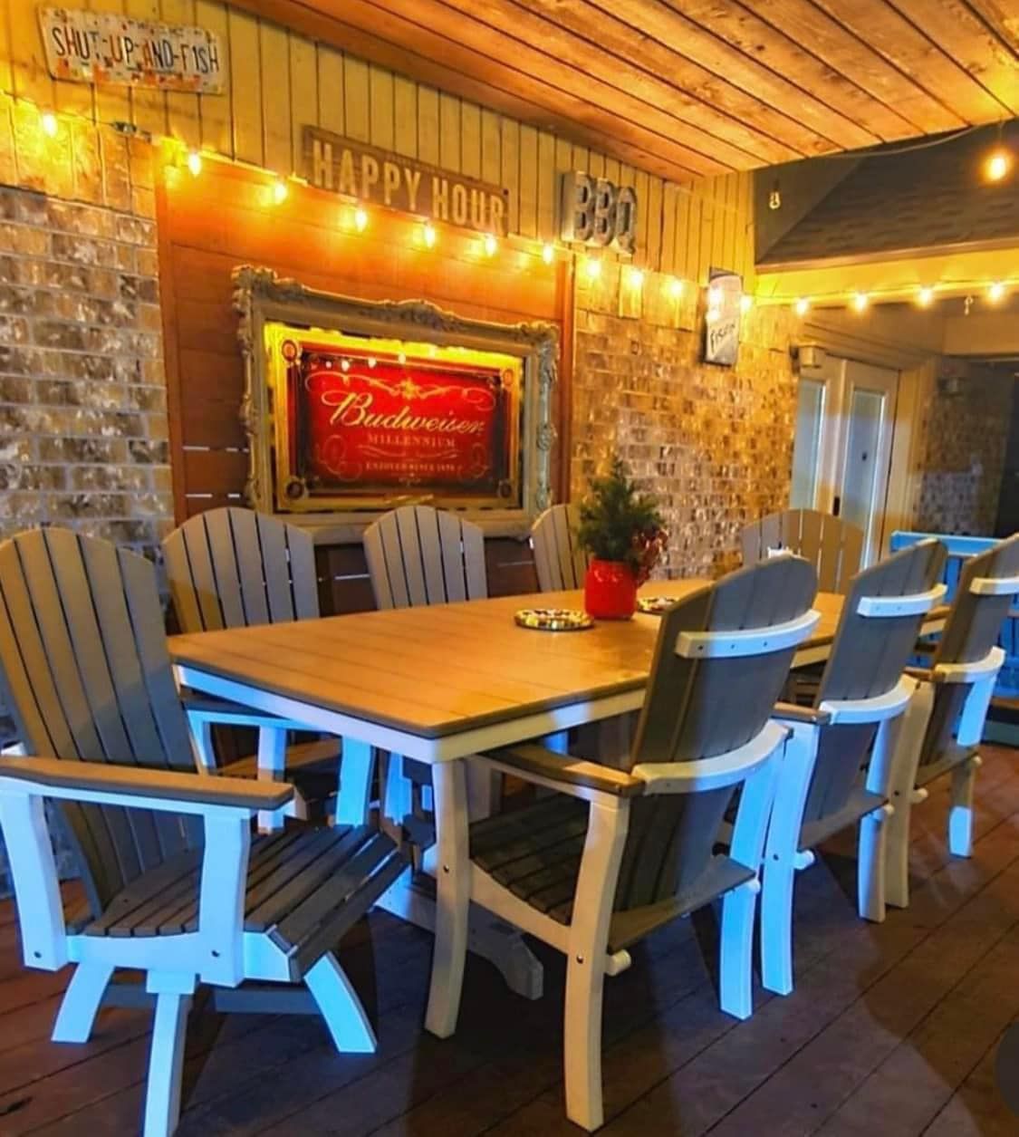 A room with a table and chairs and a sign that says happy hour