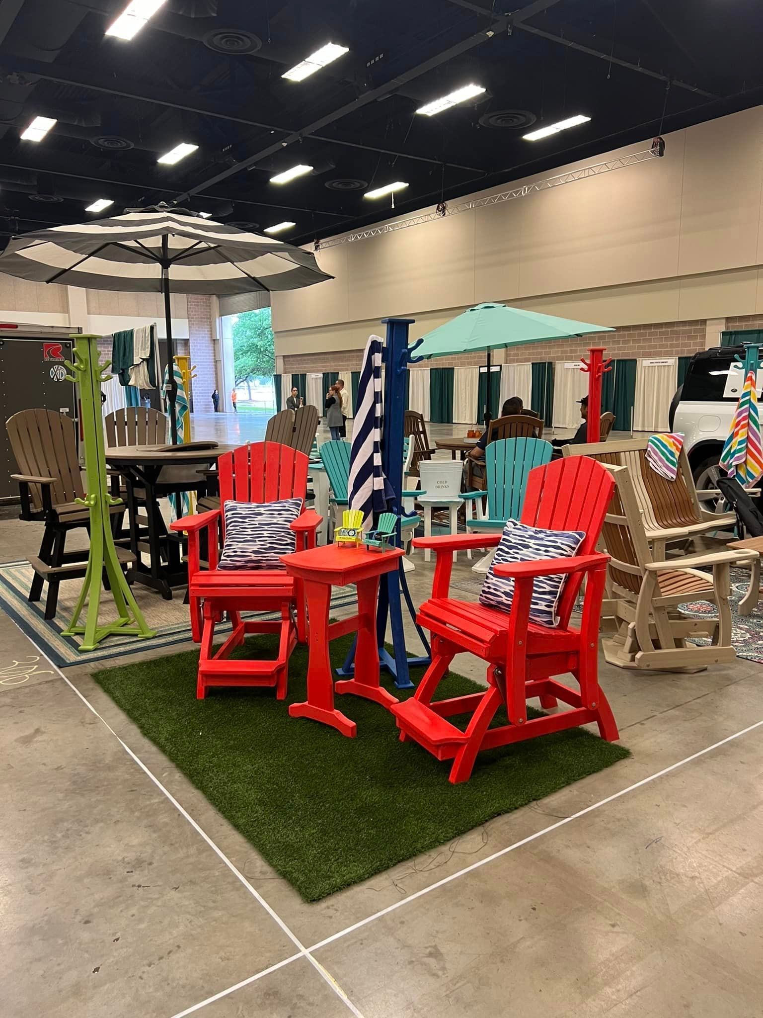 A room filled with lots of patio furniture and umbrellas.