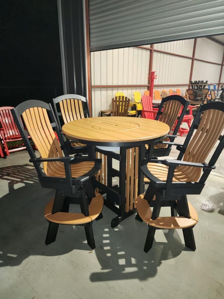 A table and chairs are sitting in a warehouse.