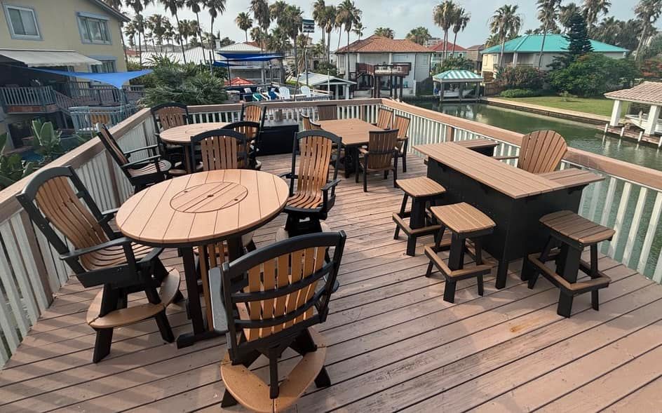 A wooden deck with tables and chairs on it
