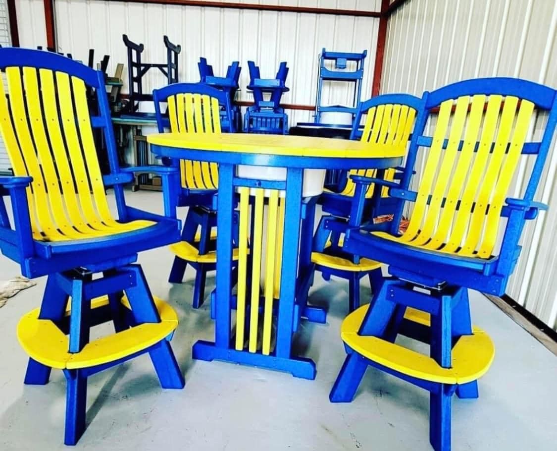 A blue table and yellow chairs are sitting in a room.