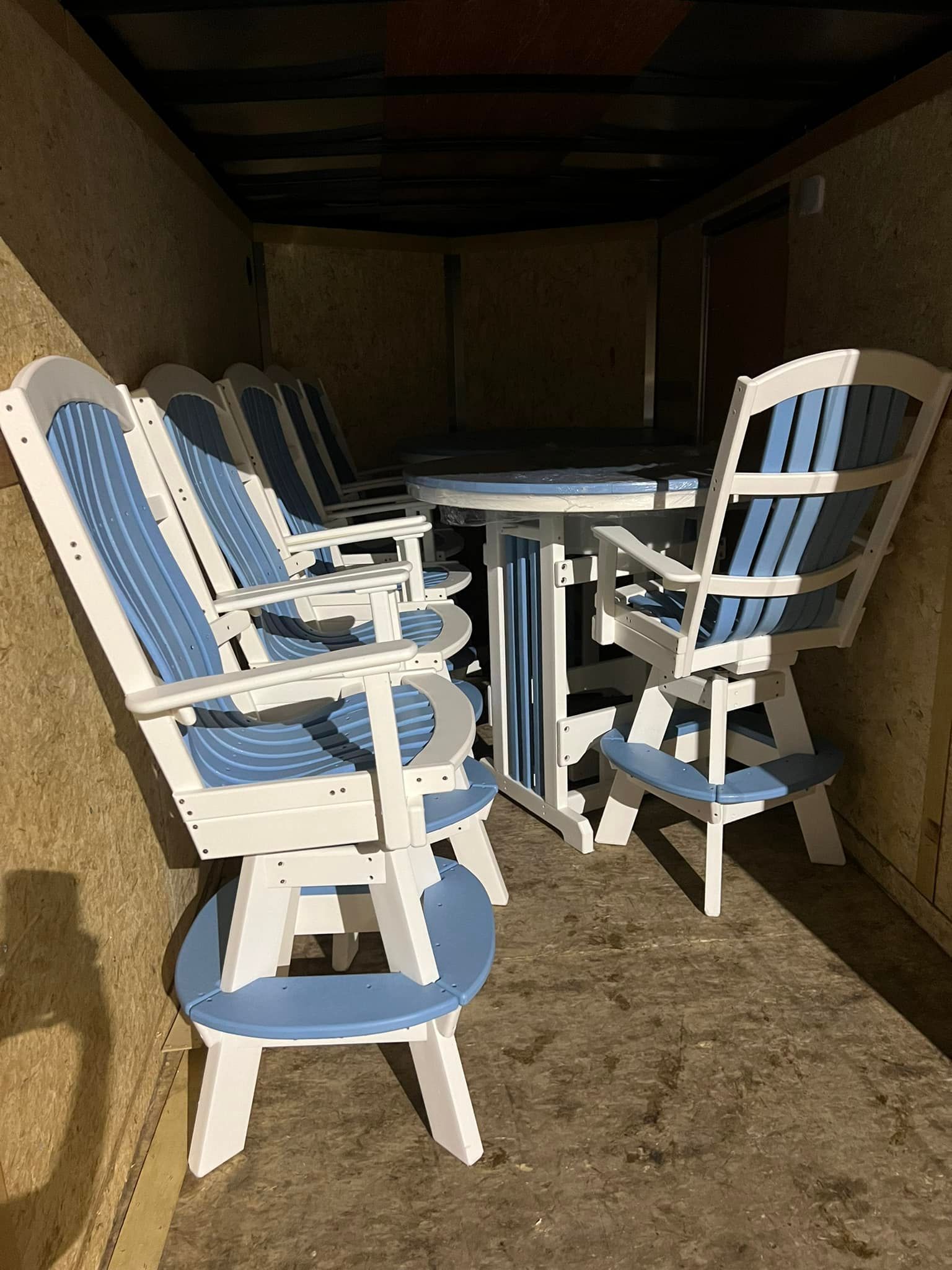A table and chairs are sitting in a room.