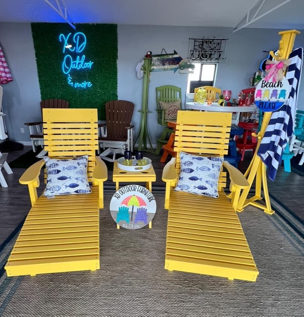 A room with yellow chairs and a sign that says xd outlet