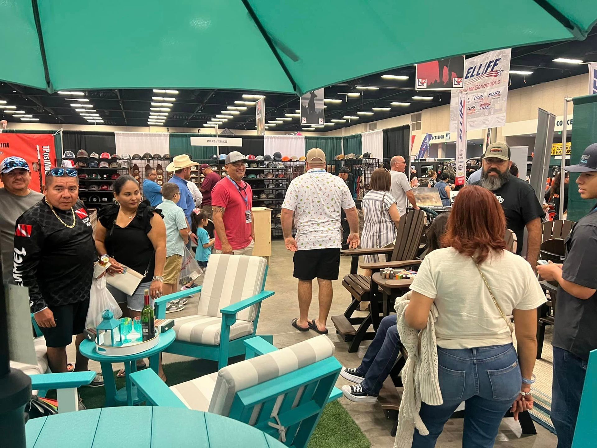 A group of people are standing around chairs and tables in a store.