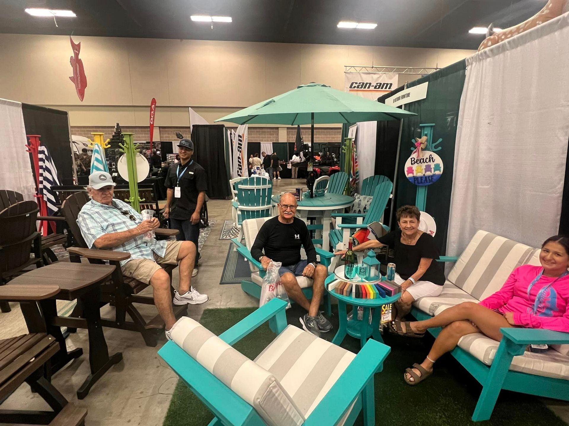 A group of people are sitting in chairs in a room.