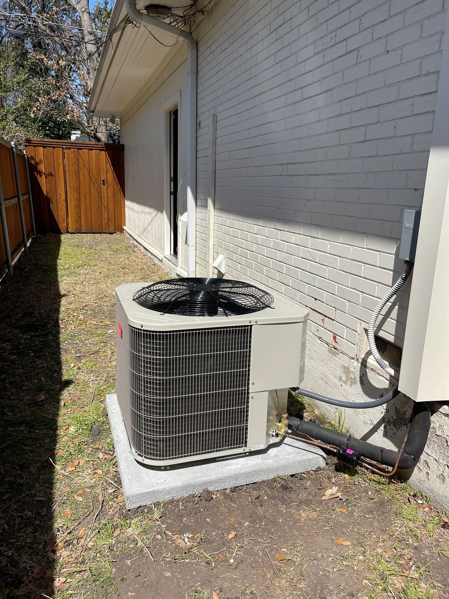 Air conditioning compressor unit outdoors.