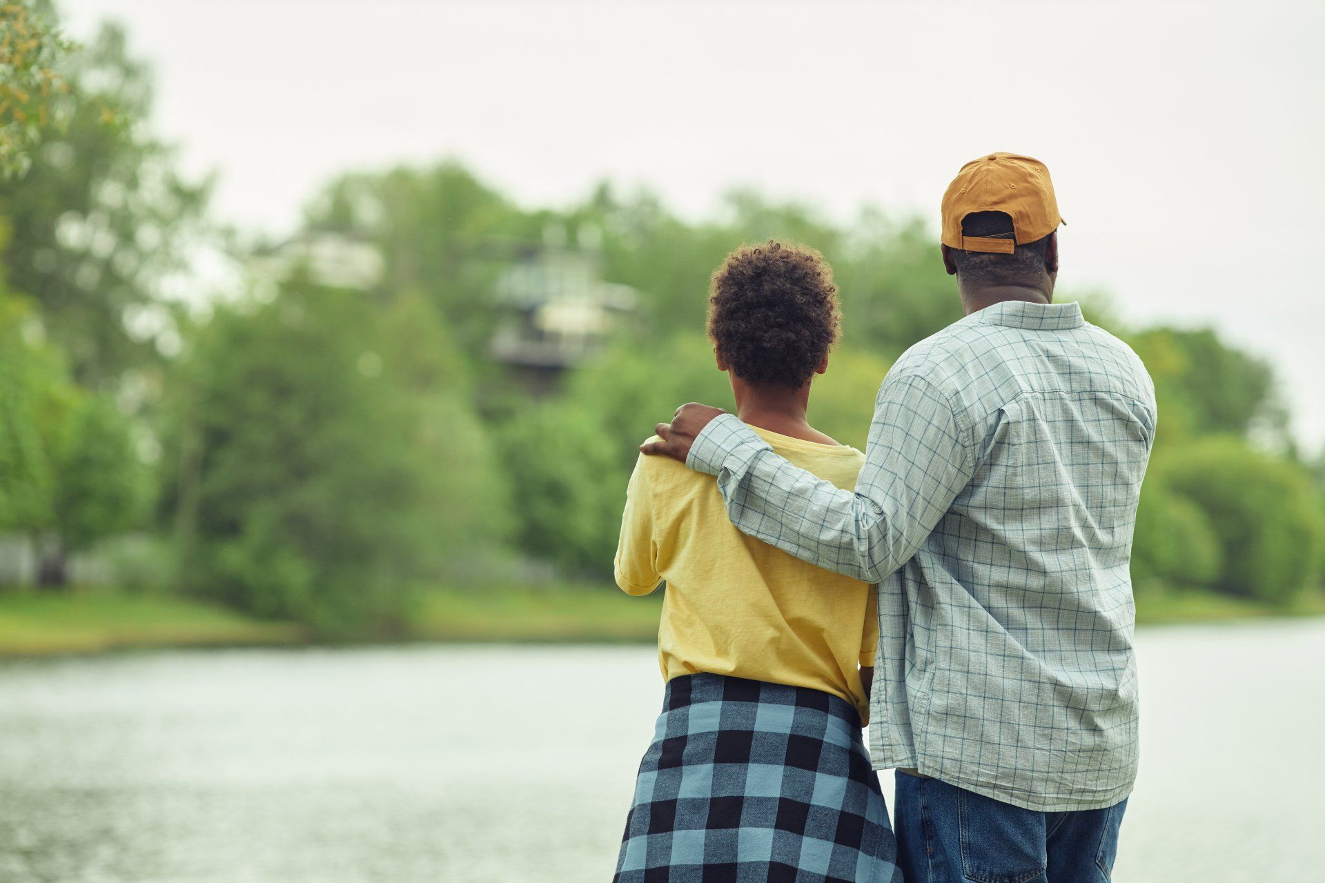 Elderly Couple Overlooking A Body of Water