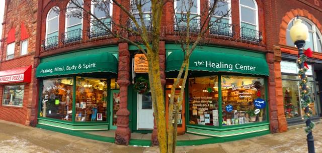 the healing center is located on the corner of a brick building .