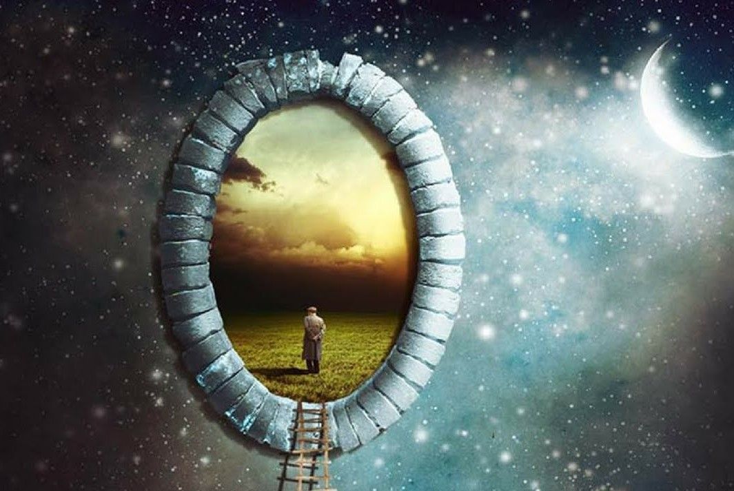 a man is standing in a field looking through a hole in the sky.