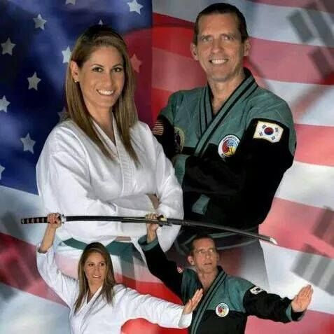 a man and a woman are holding swords in front of an american flag
