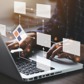 image of someone typing on computer with holographic of boxes floating above