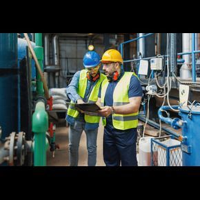 Man wearing lab coat in laboratory setting
