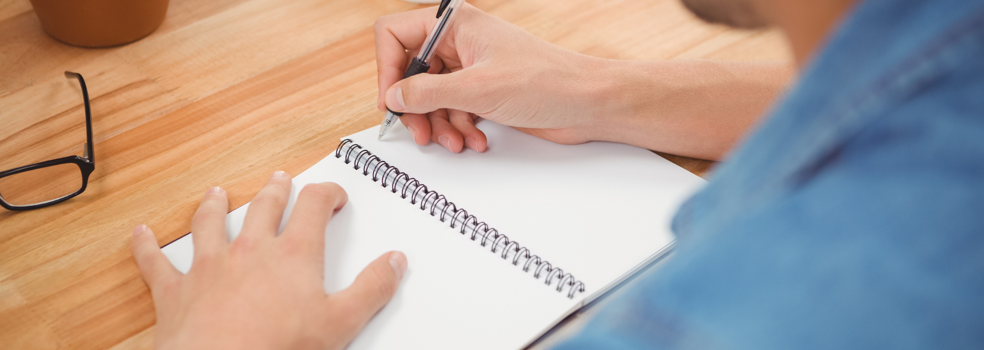 Picture of a person with a notepad. 