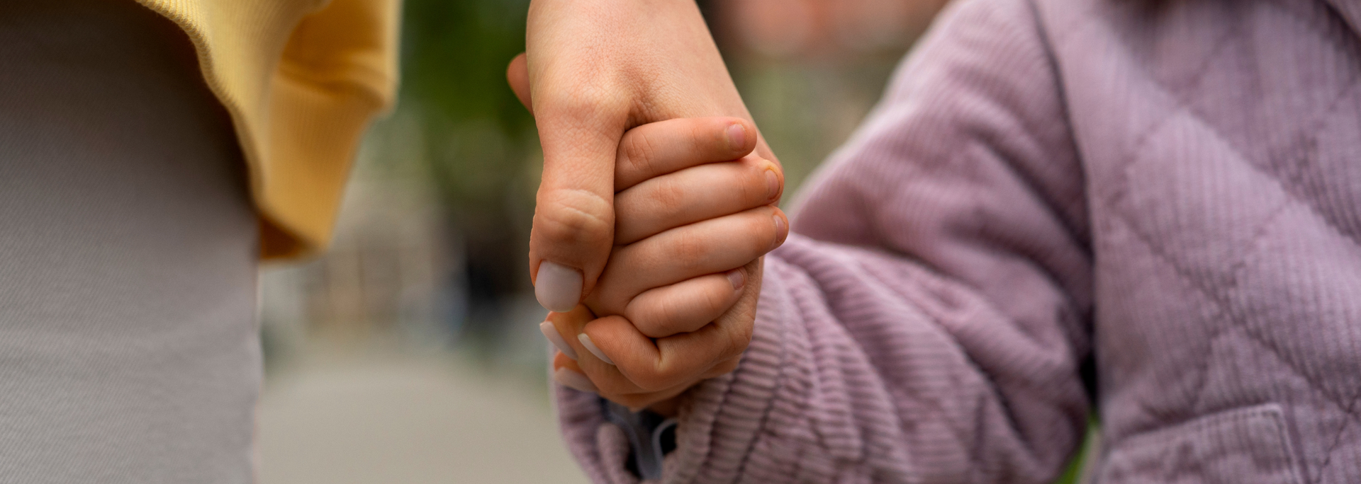 Picture a parent holding a child's hand. Picture a parent holding a child's hand.
