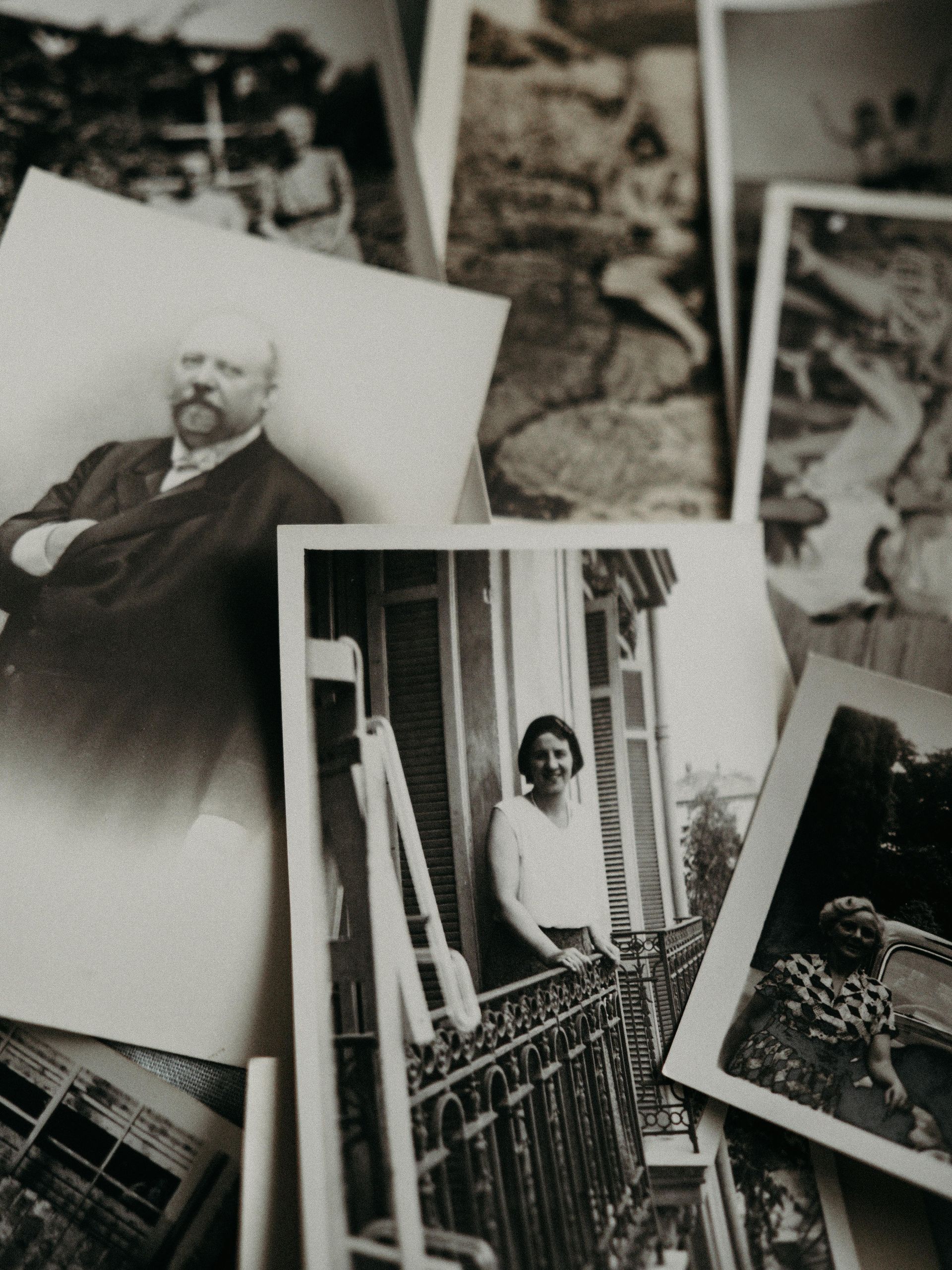 Two women are sitting on a set of stairs with a laptop.