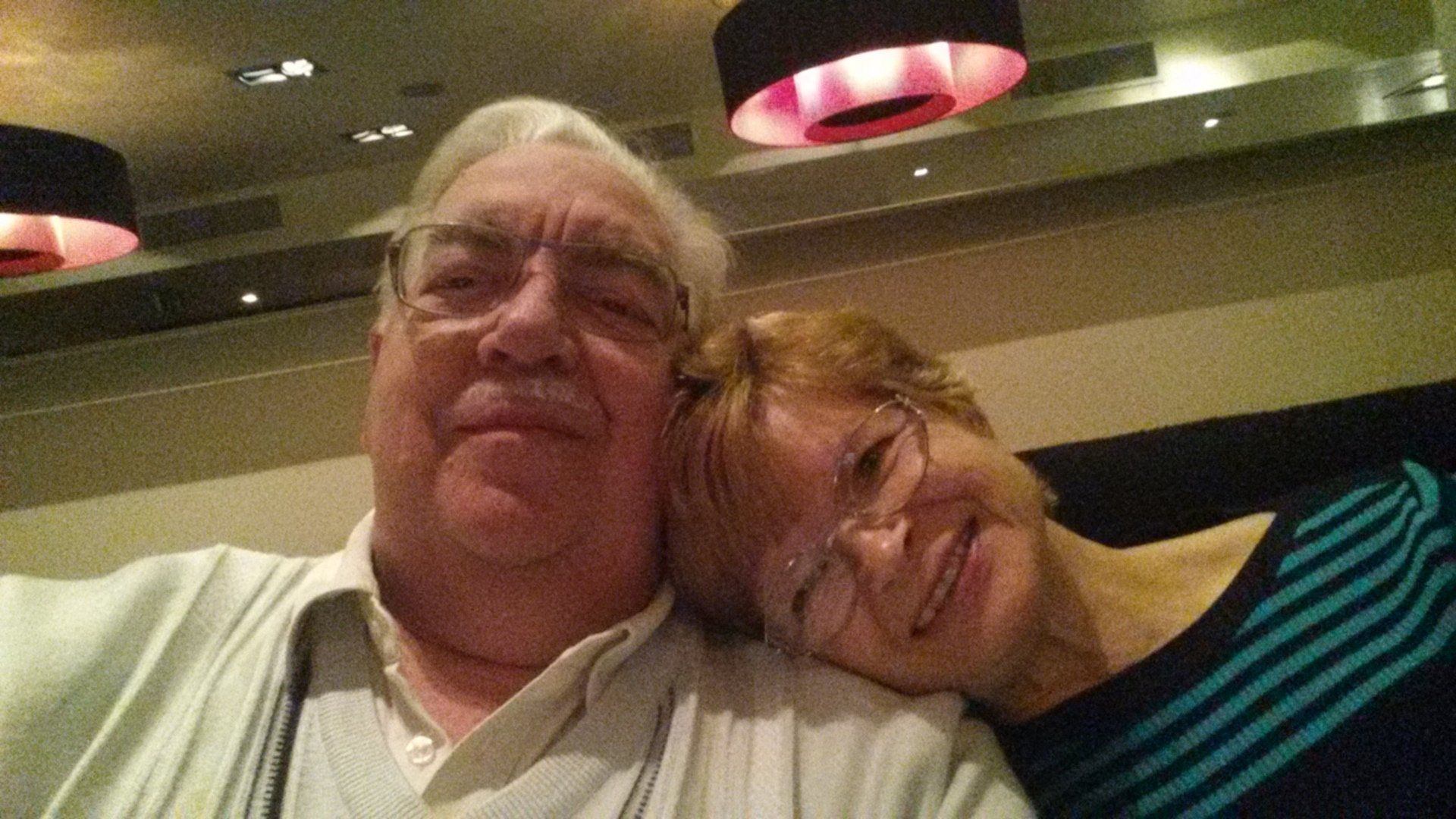 A man and a woman are posing for a picture together.